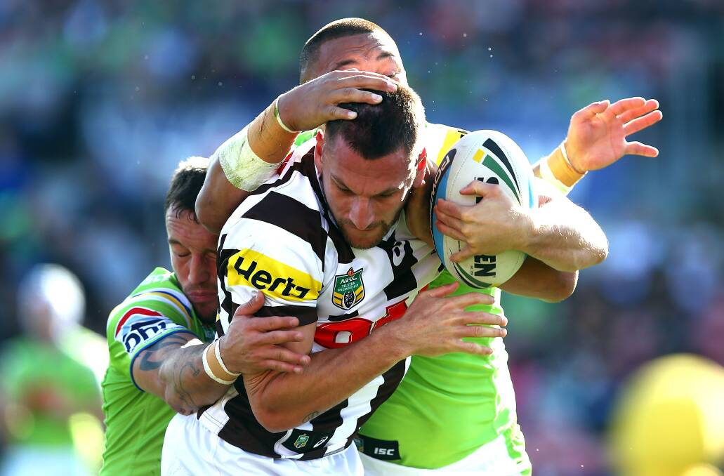 SYDNEY, AUSTRALIA - JULY 26:  Lewis Brown of the Panthers is tackled by Josh Hodgson and Josh Papalii of the Raiders during the round 20 NRL match between the Penrith Panthers and the Canberra Raiders at Pepper Stadium on July 26, 2015 in Sydney, Australia.  (Photo by Renee McKay/Getty Images)