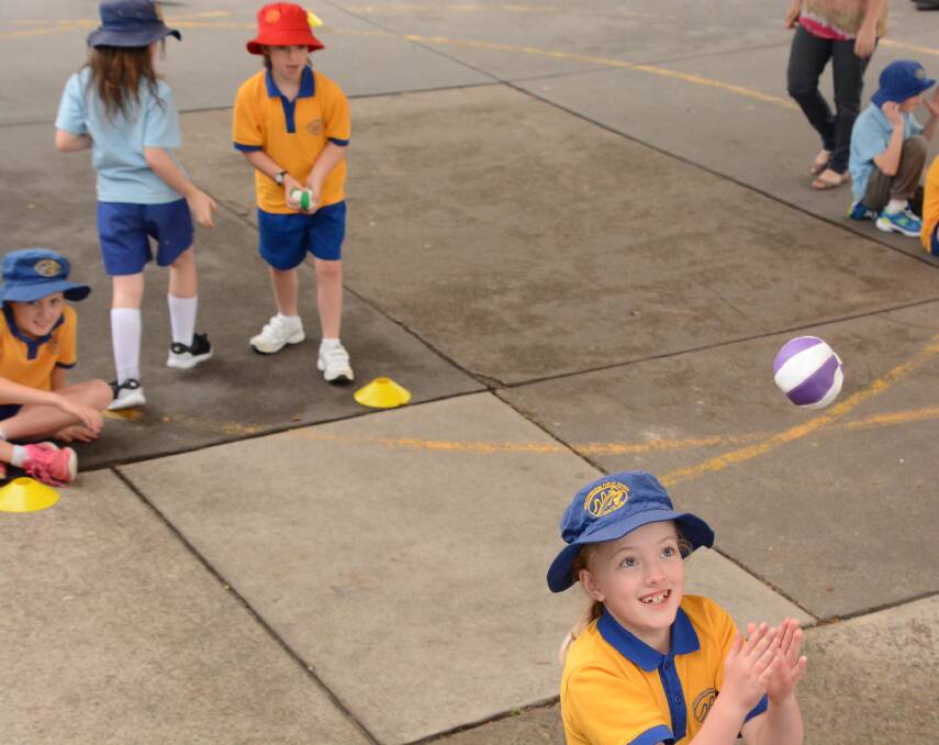 April McGannon enjoys a throwing, running and catching drill during an introductory FitLab program session at Faulconbridge Public School on November 6.