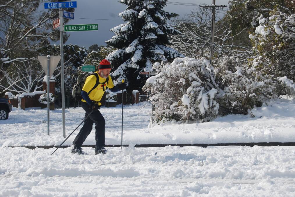 A skier makes the most of the heavy snow in Blackheath on Friday morning.