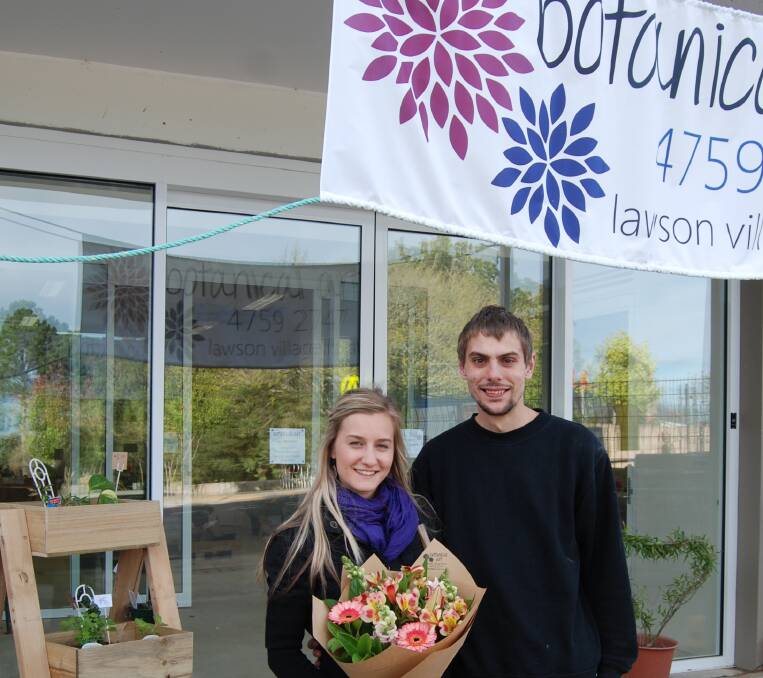 Liz Brouwer and Brendon Cannon outside their florist shop, Botanical Art.