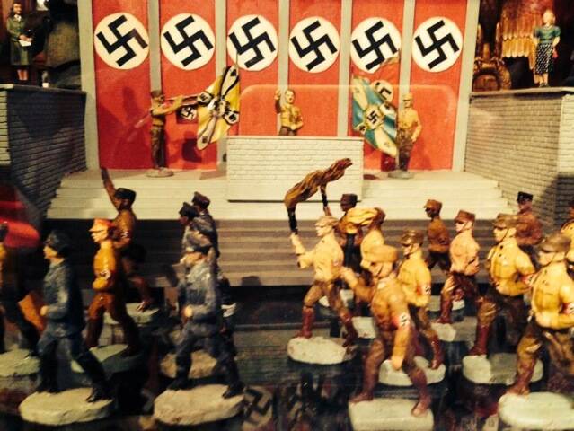 A figurine of Hitler and swastika banners forms the backdrop of this Nazi-era toy set displayed inside Leuralla's toy and railway museum.