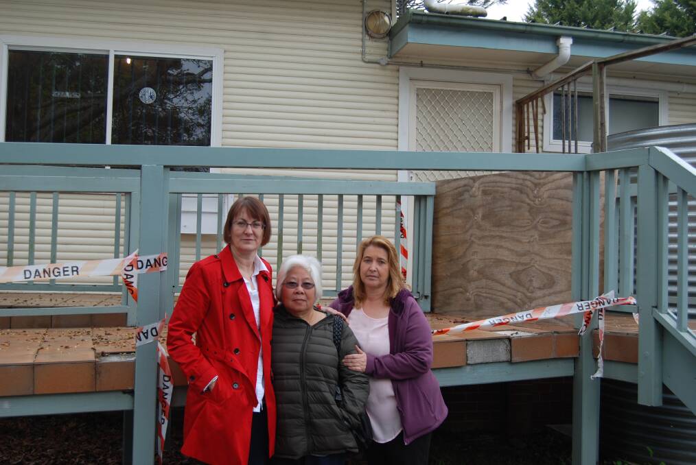 Bushfire victims Susan Templeman and Miranda Hansen with Kim Cowper, chairwoman of the Winmalee Neighbourhood Centre's management committee, outside the crumbling disabled ramp at the rear of the centre.