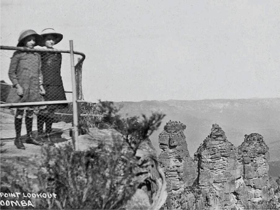 The world famous Three Sisters has attracted visitors for generations. Two visitors are seen here at Echo Point in the 1920s.