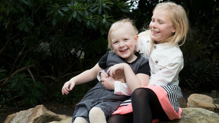 Evie Weir, 6, who is fighting cancer, with her sister, Alicia, 8 in Sydney. 31st August 2017 Photo: Janie Barrett