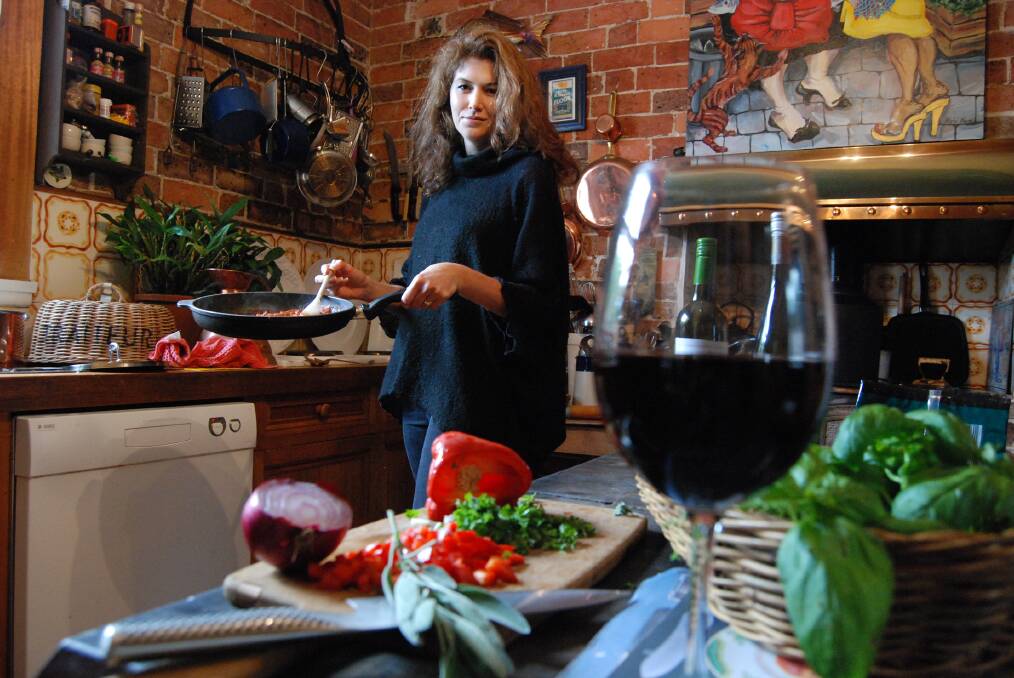 Cooking the De Bortoli Calendar, blogger Rachel Roberts cooks up a storm in her parents' home in Springwood last Friday.