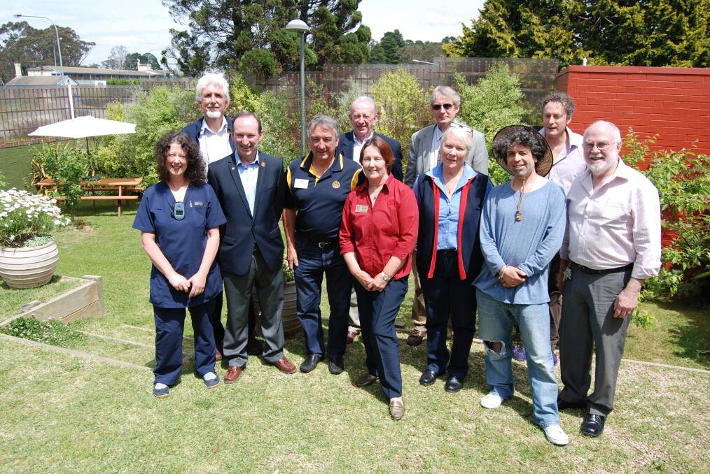 In the newly renovated garden in Katoomba Hospital's mental health unit are, back row: Project co-ordinator Gary Inglis, Bob Reid from Upper Blue Mountains Sunrise, nurse manager for mental health Jon Chesterson, social worker Michael Clarke. Front row: Nurse Claire McHalick, Central Blue Mountains Rotary Allan Byrnes, Blackheath Rotary Rex Drummond, Rotary assistant govenor Mina Howard, nurse Judy Quodling, patient Andrew Simons and nurse unit manager David Williams.