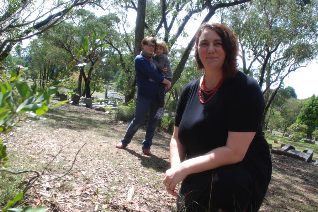 Kerrie Noonan wants Mountains residents to have a natural burial option."We want to raise awareness about the environmental benefits of natural burial for individuals, their families and the environment". Pictured with fellow advocate Belinda Heath and her four-year-old daughter Zena Agafonoff. Photographed on the bush outskirts of Wentworth Falls cemetery.