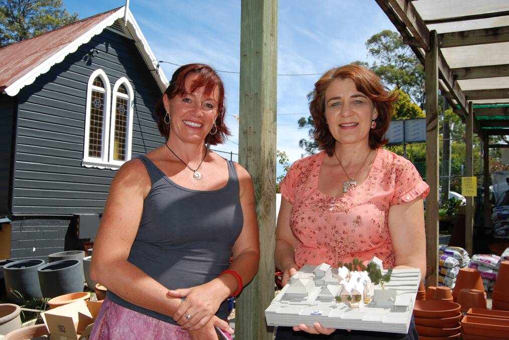 Glenbrook resident Sarah Carter and Blaxland-based architectural designer Lara Begg at 18/18A Ross Street, Glenbrook last Friday with a model of the proposed new shops and offices.
