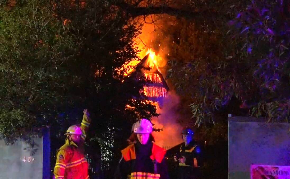 Flames engulf a house on Hawkesbury Road, Springwood just before midnight on Wednesday, July 23. Photos: Top Notch Video.
