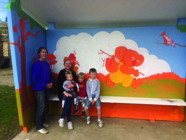 Blinky's back: Artist Jayne Shephard with Glenbrook Public School parent Anthea Strathdee and her children Cooper, Logan and Miller at the new Blinky Bill mural at the Ross Street bus shelter last week.
