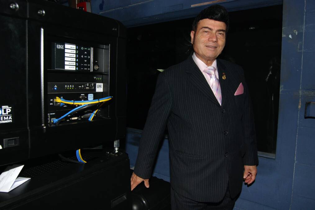 United Cinemas Australia chairman Roy Mustaca inside the projector room with the new lens recently picked up from America for United Cinemas The Edge in Katoomba.