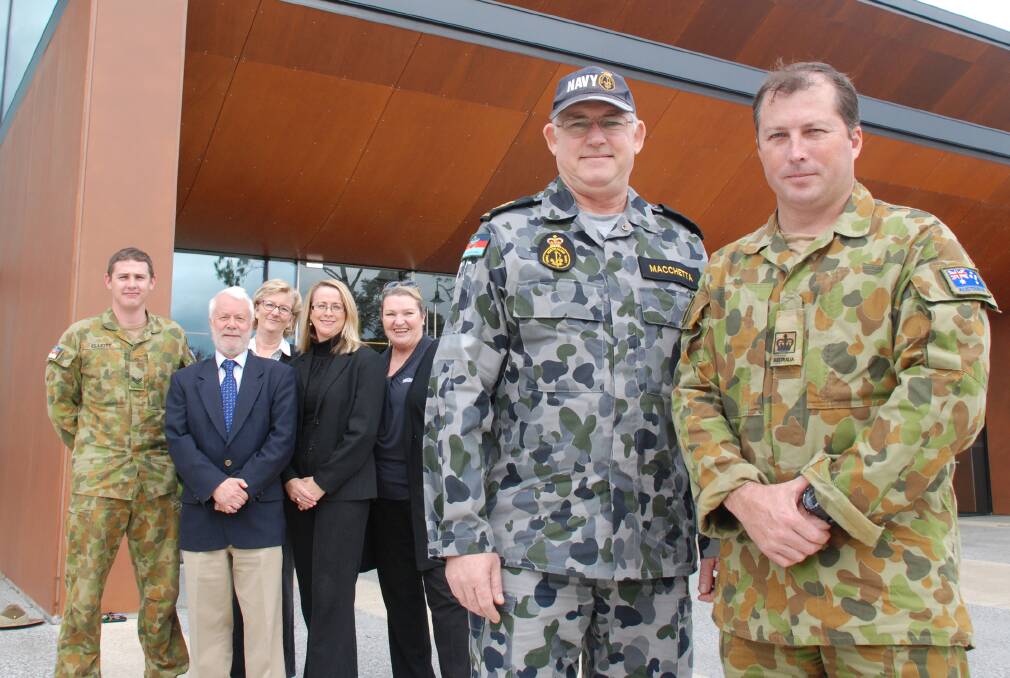 Career options: Front, Chief Petty Officer Rick Macchetta, Royal Australian Navy; Warrant Office Barry Griffiths, Australian Army outside the Blue Mountains Theatre and Community Hub in Springwood with (from left) Corporal Scott Elliott, Australian Army; Ward 3 Councillor Mick Fell, Sue Edmonds of Blue Mountains TAFE, Megan TeBay of Blue Mountains City Council and Fay Clark of Max Employment Springwood. The Defence Forces will be at the job expo on May 20.