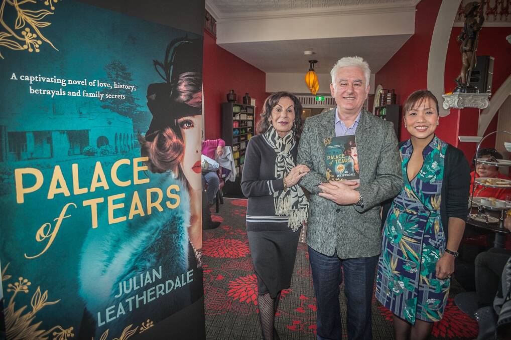 Palatial book launch: Literary agent Selwa Anthony, author Julian Leatherdale and Hydro director Huong Nguyen at the launch of his book last week. Photo: David Hill.
