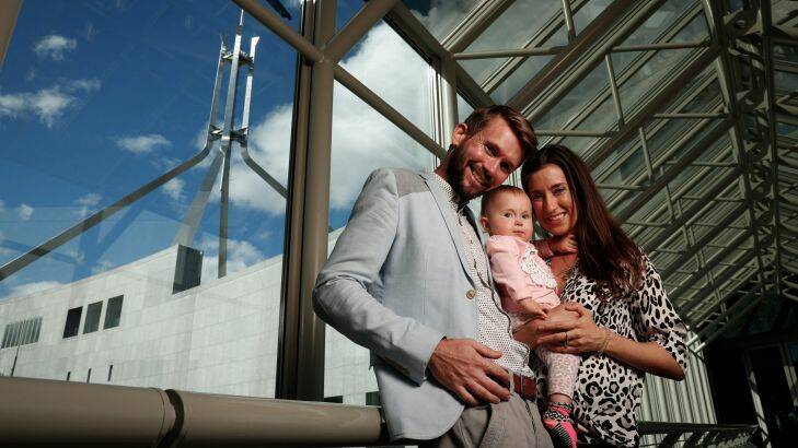 Jonathan McElwee and Bethan McElwee with their 1-year-old daughter Aviana, who visited Parliament House in Canberra for a Spinal Muscular Atrophy Australia event, on Wednesday 16 August 2017. fedpol Photo: Alex Ellinghausen