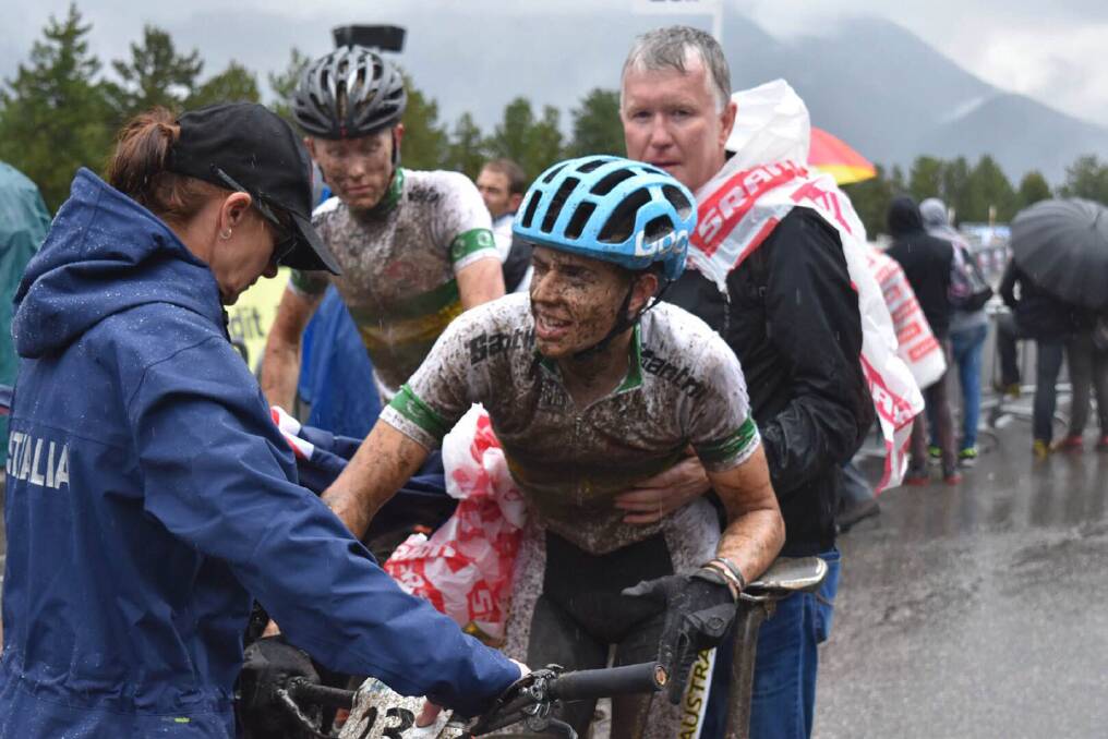 Loving the mud: Glenbrook teenager Luke Brame smiles after competing in the junior cross country Olympic solo event at the UCI Mountain Biking World Championships in atrocious conditions in Andorra earlier this month.