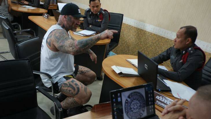 'I am not going anywhere': Tim Ward confronts police at the Pattaya Beach station, accusing them of planting drugs in his apartment. Photo: Jack Picone