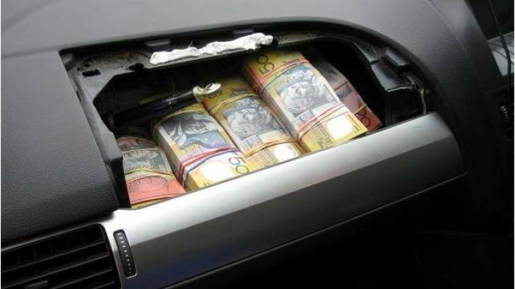 Police found $200,000 hidden in the airbag cavity of a Ford Falcon after a vehicle stop on Friday. Photo: NSW Police