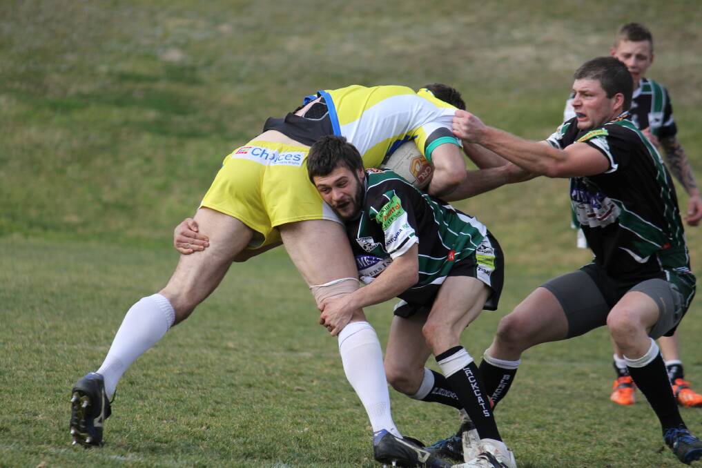 Tim Van Horen and Steve Easter show great determination in defence for the Blackcats against CSU Yellow last weekend.