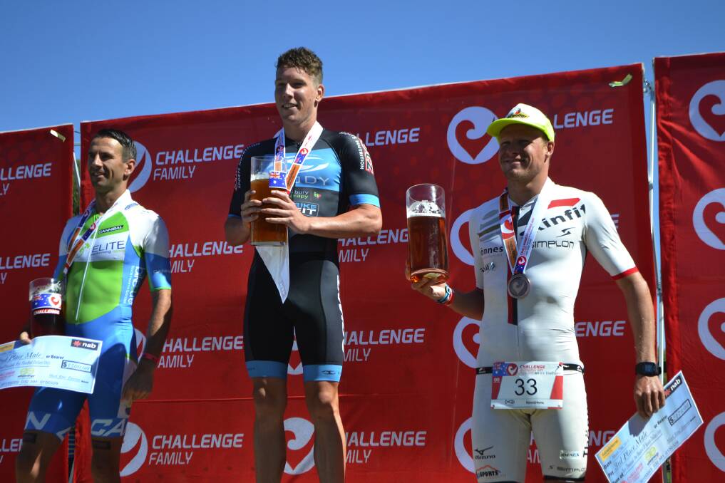 Sam Appleton (centre) on the winners podium at the Challenge Batemans Bay. Photo: Bay Post.