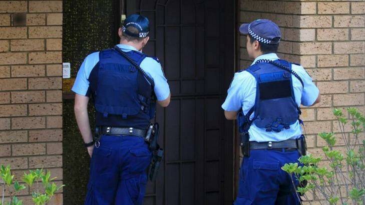 Police visit the boy's Auburn home the day after his arrest. Photo: James Alcock