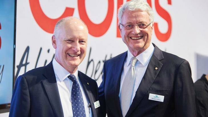 Michael Chaney (right) will hand over to Richard Goyder (left) as Woodside chairman. Photo: Aaron Bunch