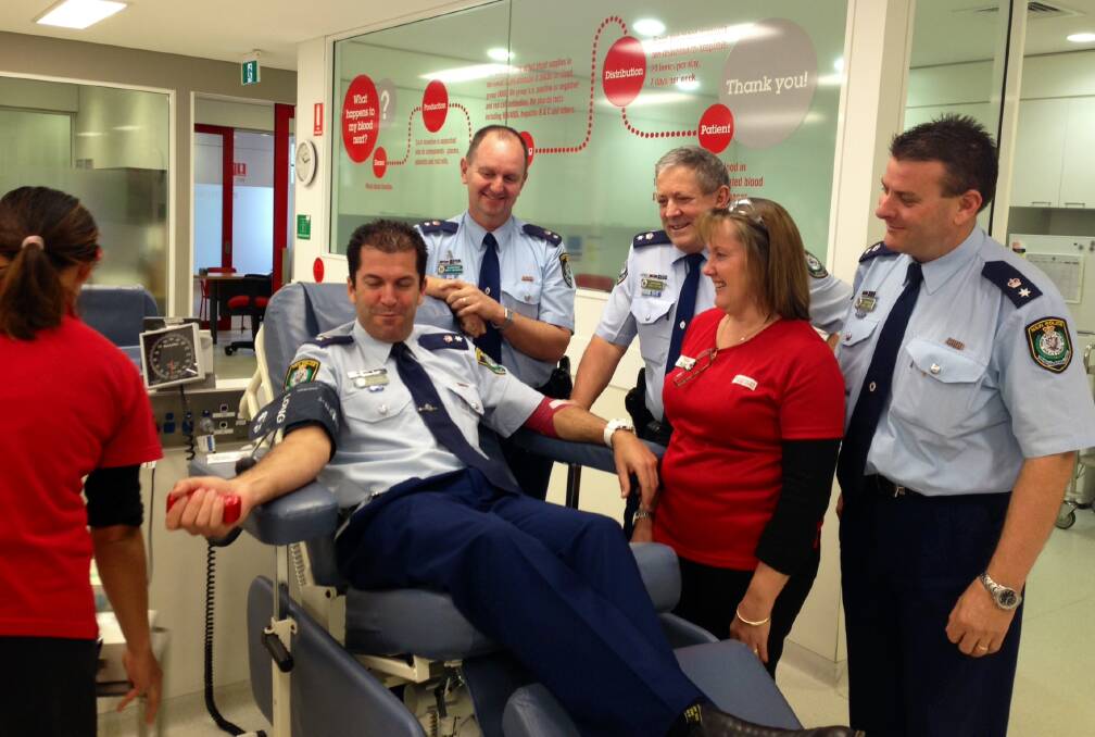 Supt Steve Egginton, commander, Hawkesbury LAC, with from L to R, Supt Brett McFadden, commander, Penrith LAC; Supt Greg Peters, commander, St Marys LAC and Supt Darryl Jobson, commander, Blue Mountains LAC, and blood bank staff.