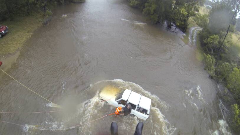DESPERATE SITUATION: Will Douglas and his wife and daughter were rescued from rising floodwaters near Moruya on Tuesday.