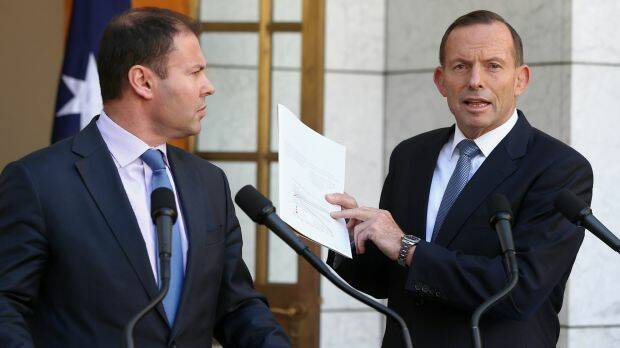 Warning shot on energy: former prime minister Tony Abbott, pictured with then-assistant treasurer Josh Frydenberg at Parliament House in March 2015.  Photo: Alex Ellinghausen
