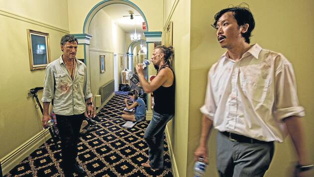 A scene from One Less God  filmed at The Carrington Hotel in Katoomba. Pictured are Joseph J.U. Taylor (as John), Nathan Kaye (as Oz), and Quentin Yung (as Yang). Photo: Nelson Lau