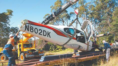 Salvage crews started dismantling the Cirrus SR22 on Tuesday after aviation authorities visited.
