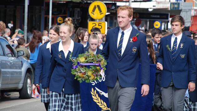 St Columba's Catholic College students march in the Anzac parade at Springwood.