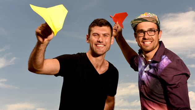 Stars of the hit movie Paper Planes Dylan Parker and James Norton demonstrate the simple Nakamura Lock plane design. They will run workshops at the inaugural Blaxland Public School twilight fete. Photo: Steven Siewert
