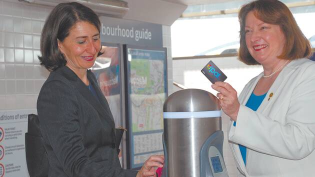 NSW Minister for Transport Gladys Berejiklian "taps off" at Springwood with her Opal Card. She's joined by a fellow Opal user, Blue Mountains MP Roza Sage.