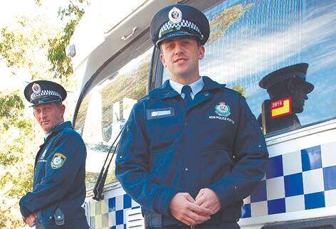 Jason Russell, 26 (front), and Michael Walton, 38, on their first day on the job at Springwood Police Station on Monday.