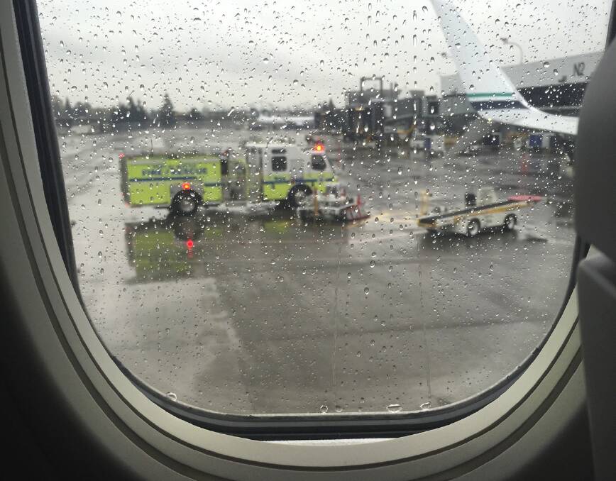 The view from the tarmac at Seattle-Tacoma International Airport after the Alaska Airlines flight returned shortly after takeoff on discovering a worker was trapped in the cargo. Photo: Zac Suito.
