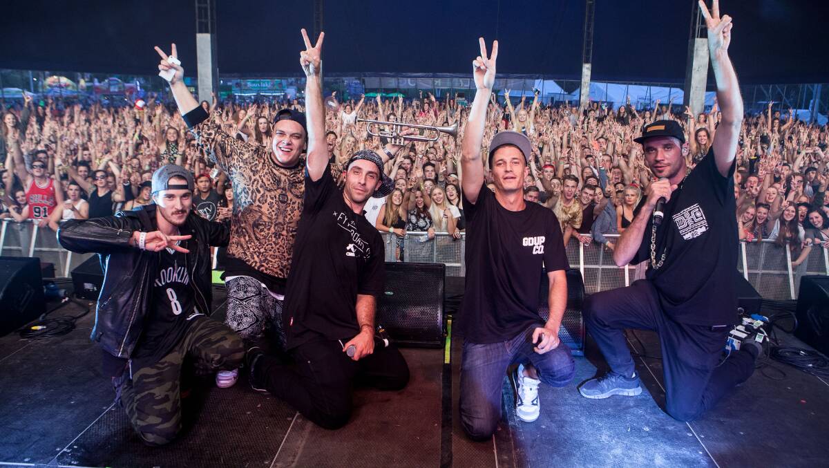 Thom Crawford (left) on stage with Blue Mountains hip-hop group Thundamentals this year. Photo: Cole Bennetts.