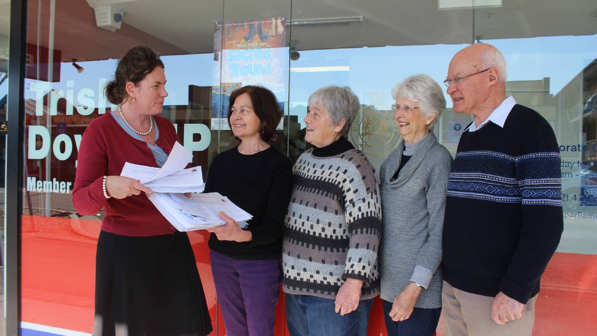 Trish Doyle MP receives the 'Save our LEP' petition from Blue Mountains Conservation Society representatives Kerry Horne, Carolyn Williams, Anne Cantwell and Bob Cantwell outside her electorate office in Springwood.