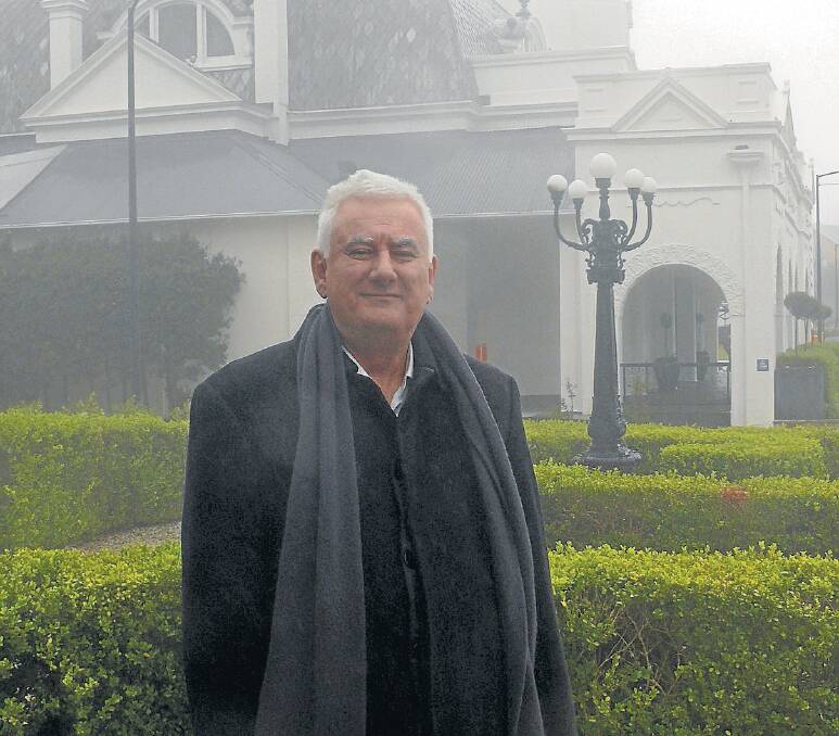 Leura author Julian Leatherdale outside the misty clifftop hotel The Hydro Majestic. 