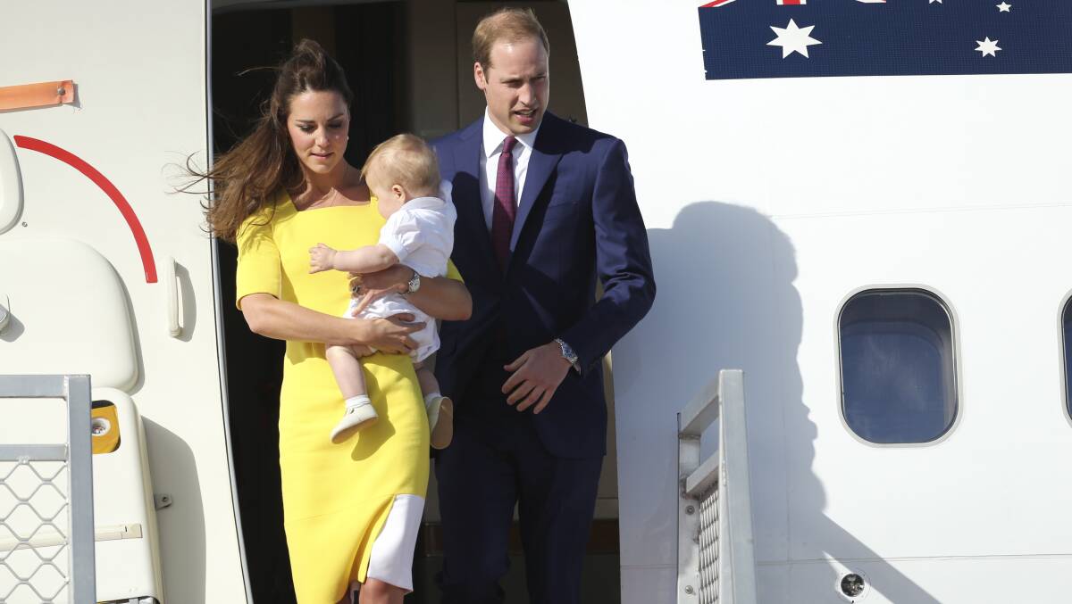 Catherine, Duchess of Cambridge (left) holding Prince George and Prince William, Duke of Cambridge (right) arrive at Sydney International Airport on Wednesday, April 16. Photo: Kate Geraghty/Fairfax Media.