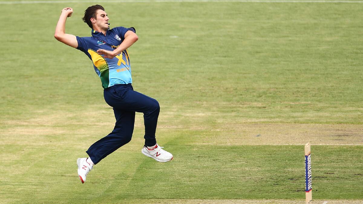 Pat Cummins bowls during the tour match between the Prime Minister’s XI and England at Manuka Oval, Canberra on January 14 this year. Photo: Mark Nolan/Getty Images.