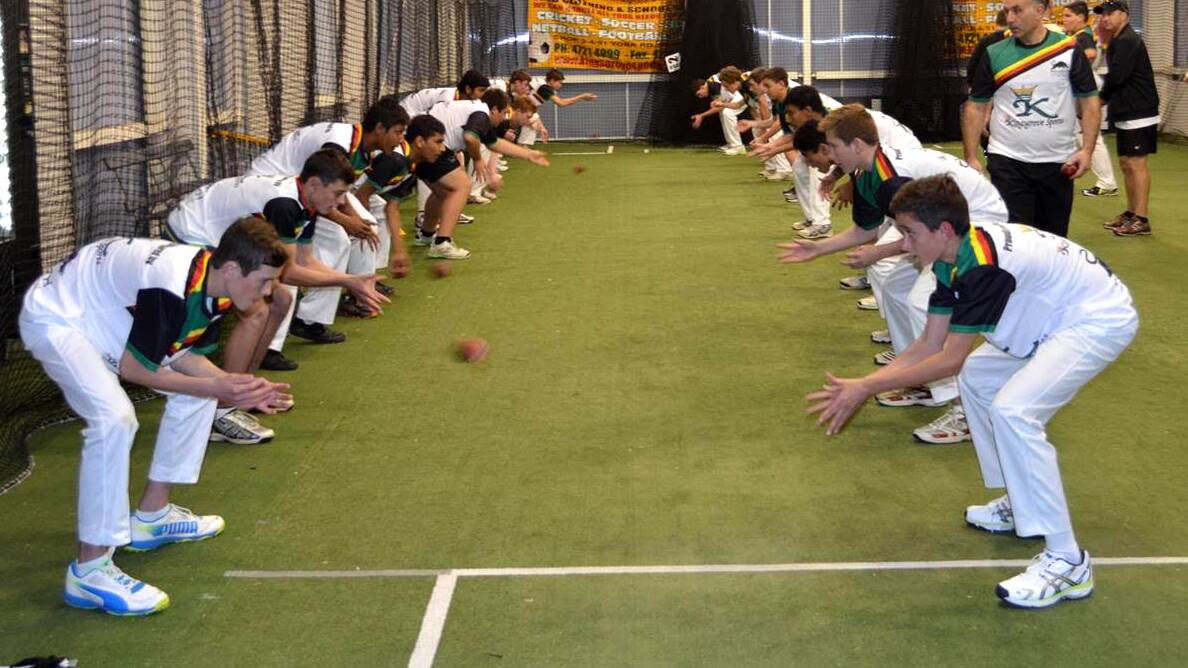 Players go through their paces during a catching drill at the inaugural training session at Penrith Cricket Club's elite training academy on June 17.