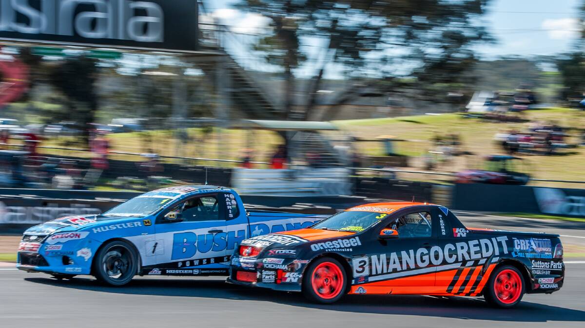 David Sieders goes up the inside of a car in his V8 Ute last year. Picture: Jeff Thomas