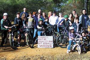 Rallying point: Residents and bike riders at Hat Hill Road on July 8.