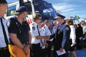 A long time coming: Rural Fire Service Comissioner Shane Fitzsimmons congratulates Valley Heights captain Stephen Price and other brigade members at the official opening of their new station on Saturday.