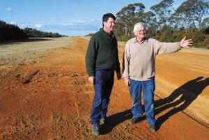 Supporting continued use of Katoomba Airfield: Liberal candidate for Ward 1 Michael Begg with leaseholder and chief flying instructor of Katoomba Airfield Rodney Hay next to the main runway on July 27.