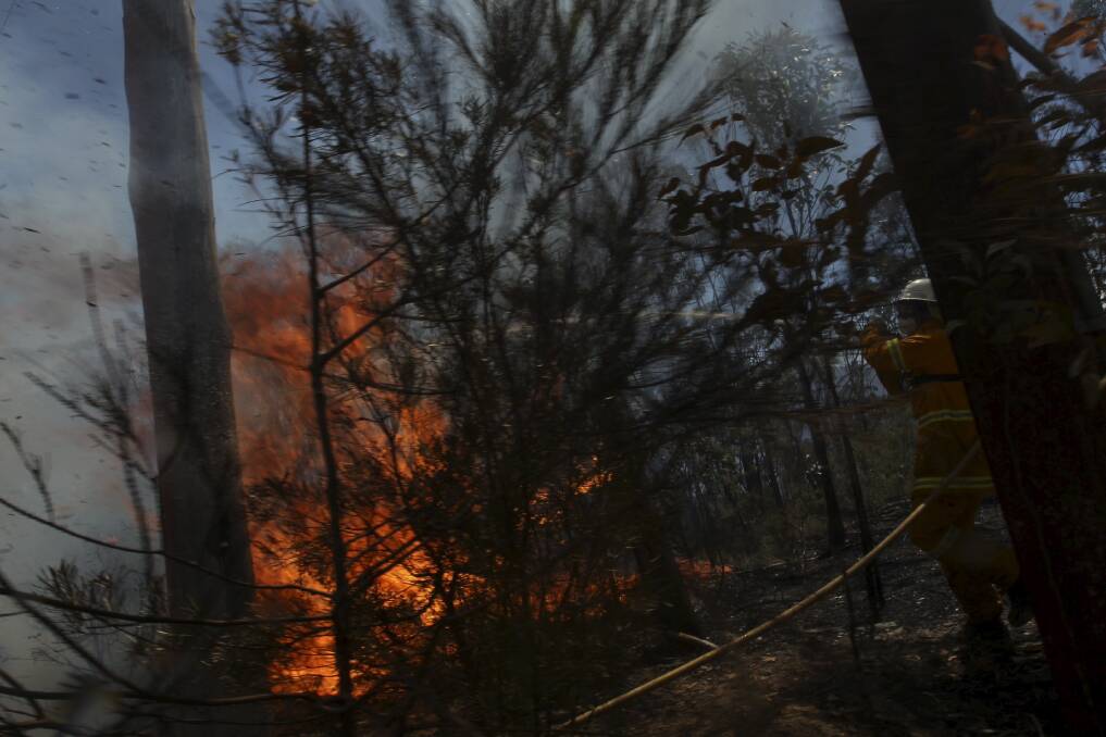 Fires threaten to break out across Mountain Lagoon Road, near Bilpin. October 23, 2013. Photo: Nick Moir