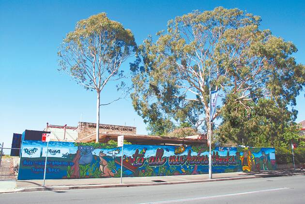 The bushfire thank you mural outside the old Springwood Civic Centre in Macquarie Road and (inset) the artists who designed and painted it, from left, Janne Birkner, Andrew Davis and Giles Fryer.