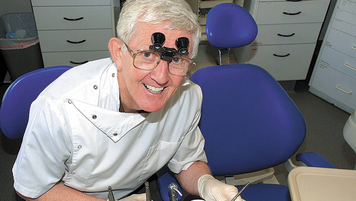 Making a difference: Dr Graham Toulmin, AM, "relaxing" in his modern Springwood dental clinic.