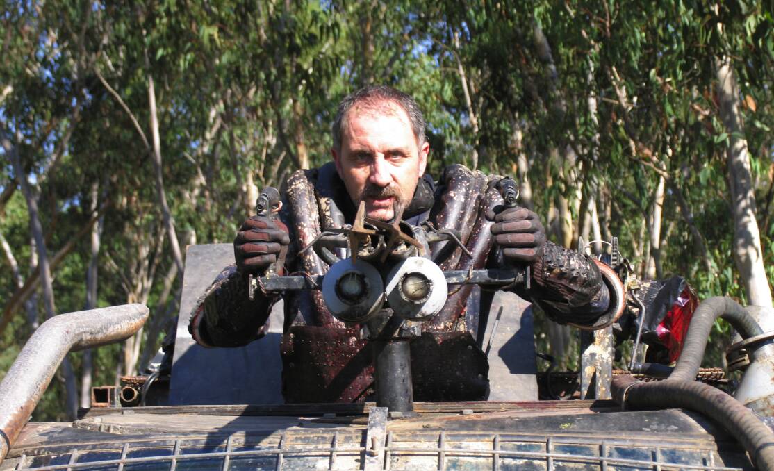 Keith Agius (who plays Frank) atop ‘The Beast’ on the zombie movie set for Wyrmwood. Photo: Monique Westermann.