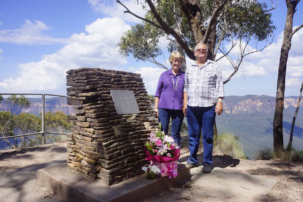 Marg and Ivan Thelander at the memorial to the four boys killed in the 1957 bushfire at Perrys Lookdown. Photo: Wyn Jones.
